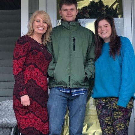 Patty harkens with her son on left side and right side her daughter.